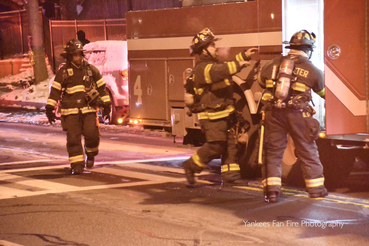 Rochester firefighters operating at a working fire in a high-rise apartment building on East Main Street