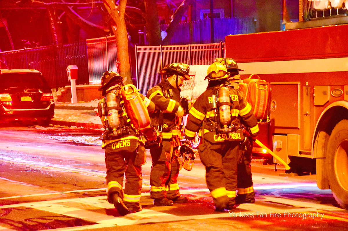 Rochester firefighters operating at a working fire in a high-rise apartment building on East Main Street