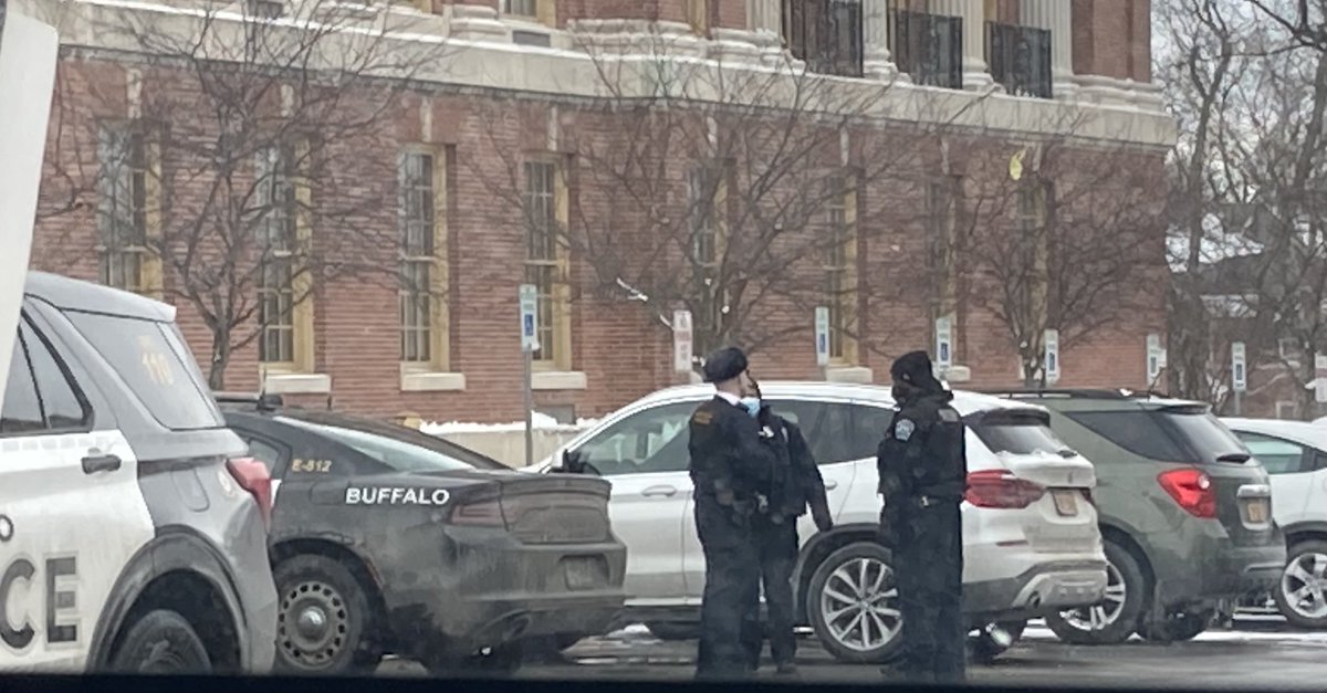 Several Buffalo police officers and vehicles on the scene at Bennett High School 