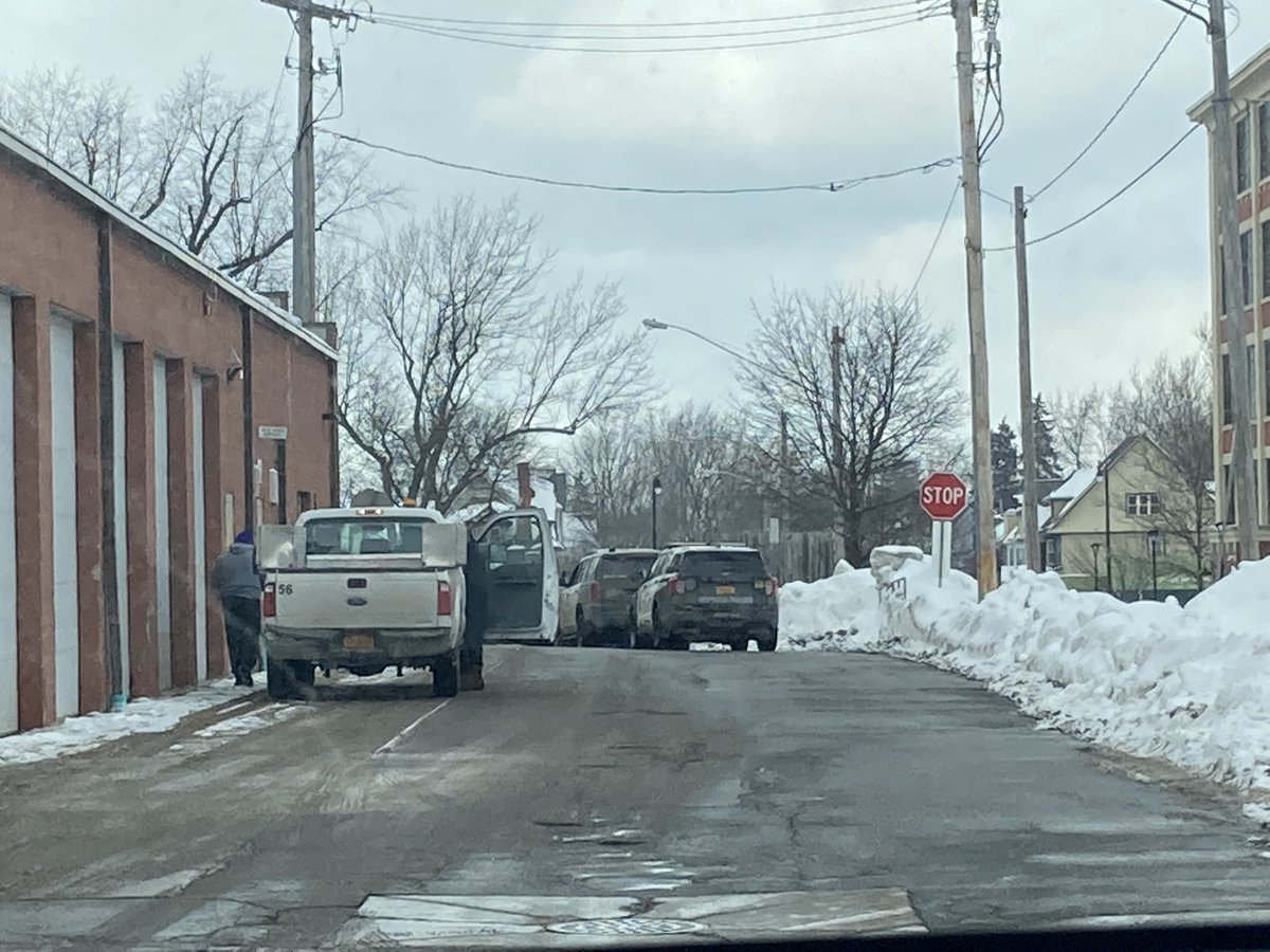 Several Buffalo police officers and vehicles on the scene at Bennett High School 