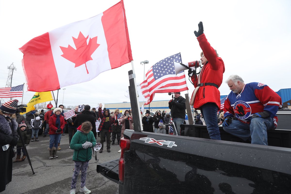 Wendy Dominski of Youngstown, Ny offers a prayer before a caravan heads to the Peace Bridge in solidarity of Canadian truckers and in protest of Covid health mandates