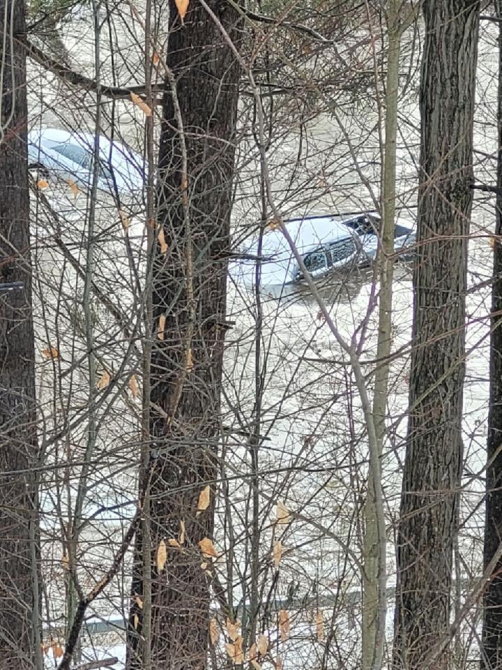 MULTIPLE CARS stuck in the Au Sable River. Photo courtesy of Kevin Zaumetzer who took these in Au Sable Forks, where he says an ice jam is causing flooding to several homes