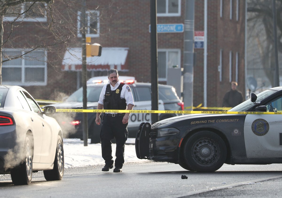 Police at the scene of a shooting this morning on Hertel Ave. at Shoshone St. in Buffalo. Police said they shot a man just after 4:30 a.m