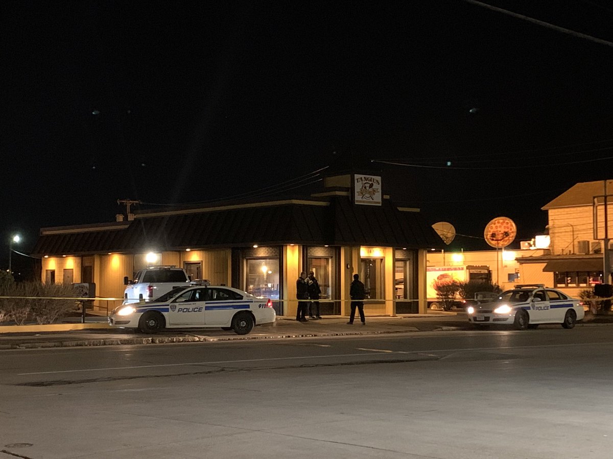 a 40-year-old man was shot and killed early this morning on East Ridge Rd. Our crew saw the Medical Examiner, blue tarps around Tangie's Restaurant, and a crowd of about 30 people, some of whom were noticeably upset and trying to get through police tape.