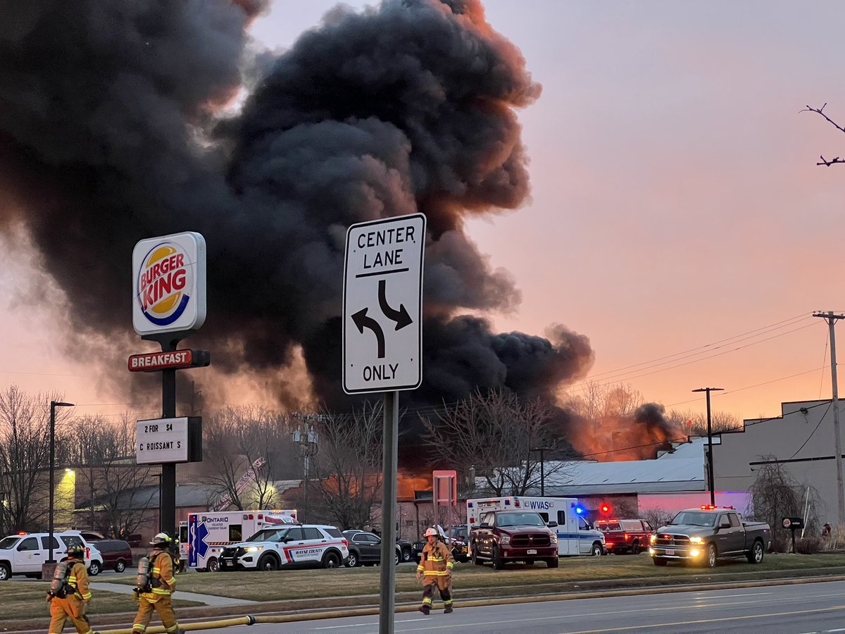 Route 104 in Williamson is shut down. Large fire at Thatcher. Fire appears to be at the rear of the property/structure. The smoke can be seen for miles down 104