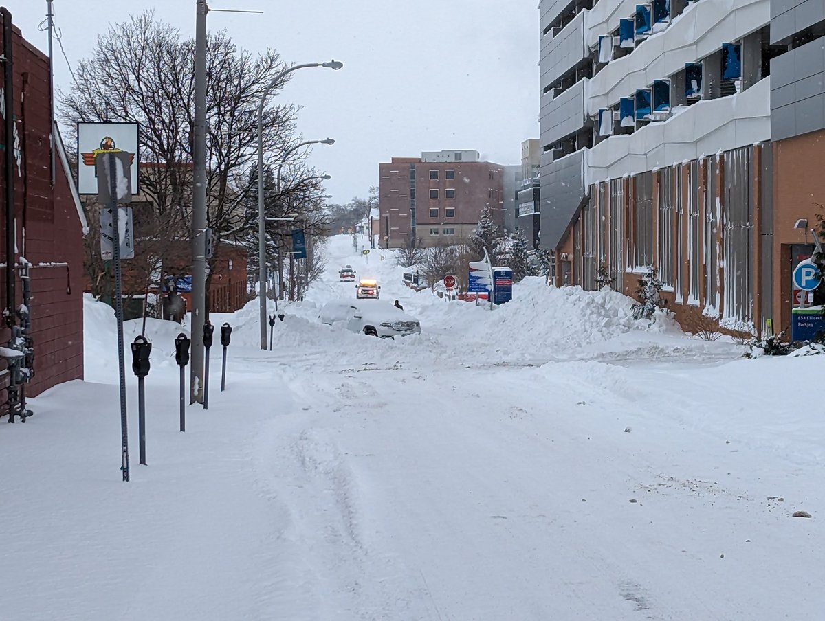 There were lots of emergency personnel and snow clearing crews out.   stuck car and flashing lights in the distance.  Buffalo Firefighters drove by me on Main Street and some contractors were out clearing snow on Linwood