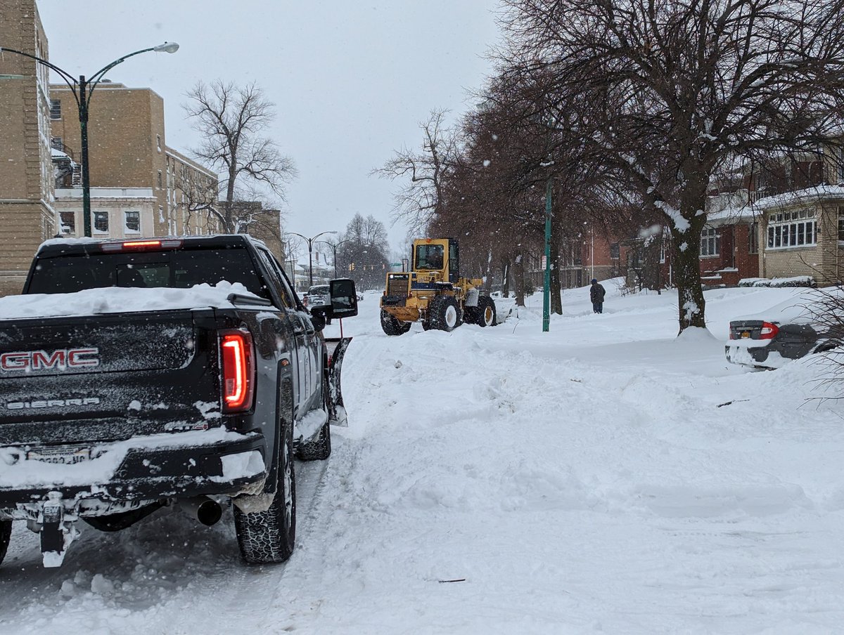 There were lots of emergency personnel and snow clearing crews out.   stuck car and flashing lights in the distance.  Buffalo Firefighters drove by me on Main Street and some contractors were out clearing snow on Linwood