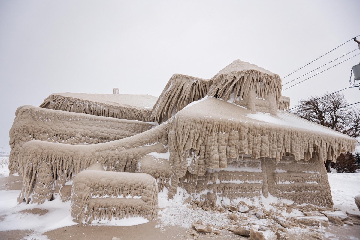 Millions of Americans have endured a winter storm that forecasters said was nearly unprecedented in its scope. These pictures show the ice that formed over a restaurant in Hamberg, New York from the spray of Lake Erie waves 