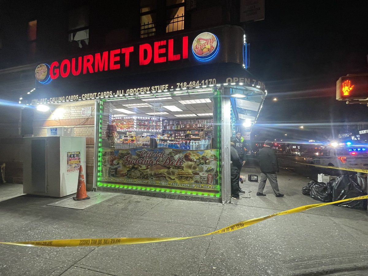 A 28yo man is dead & 3 others injured in East Tremont shootings tonight. One of the scenes, outside this deli on E Tremont Ave, had memorial candles outside from a different fatal shooting on Monday.