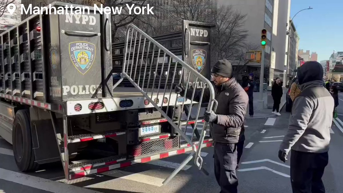 Steel barricades are being unloaded outside Manhattan criminal courthouse. Numerous Metal Barricades Arrive Outside The Manhattan Criminal Courthouse In New York City, Ahead Of A Possible Indictment Of Former President Trump This Week. With
