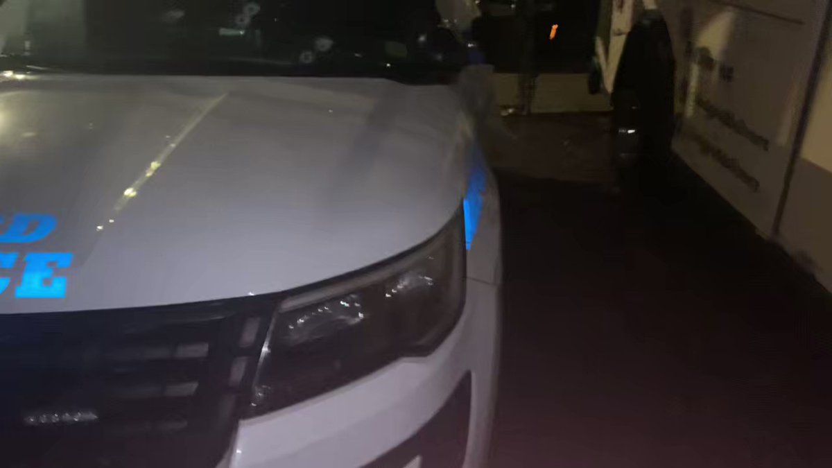 @NYPD9Pct officers open fire on gunman in East Village. Five bullets piercing the front windshield of this cruiser. No one was hit. Suspect in custody.