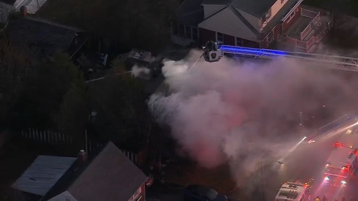 1 dead in Hicksville house fire, firefighters battle windy conditions