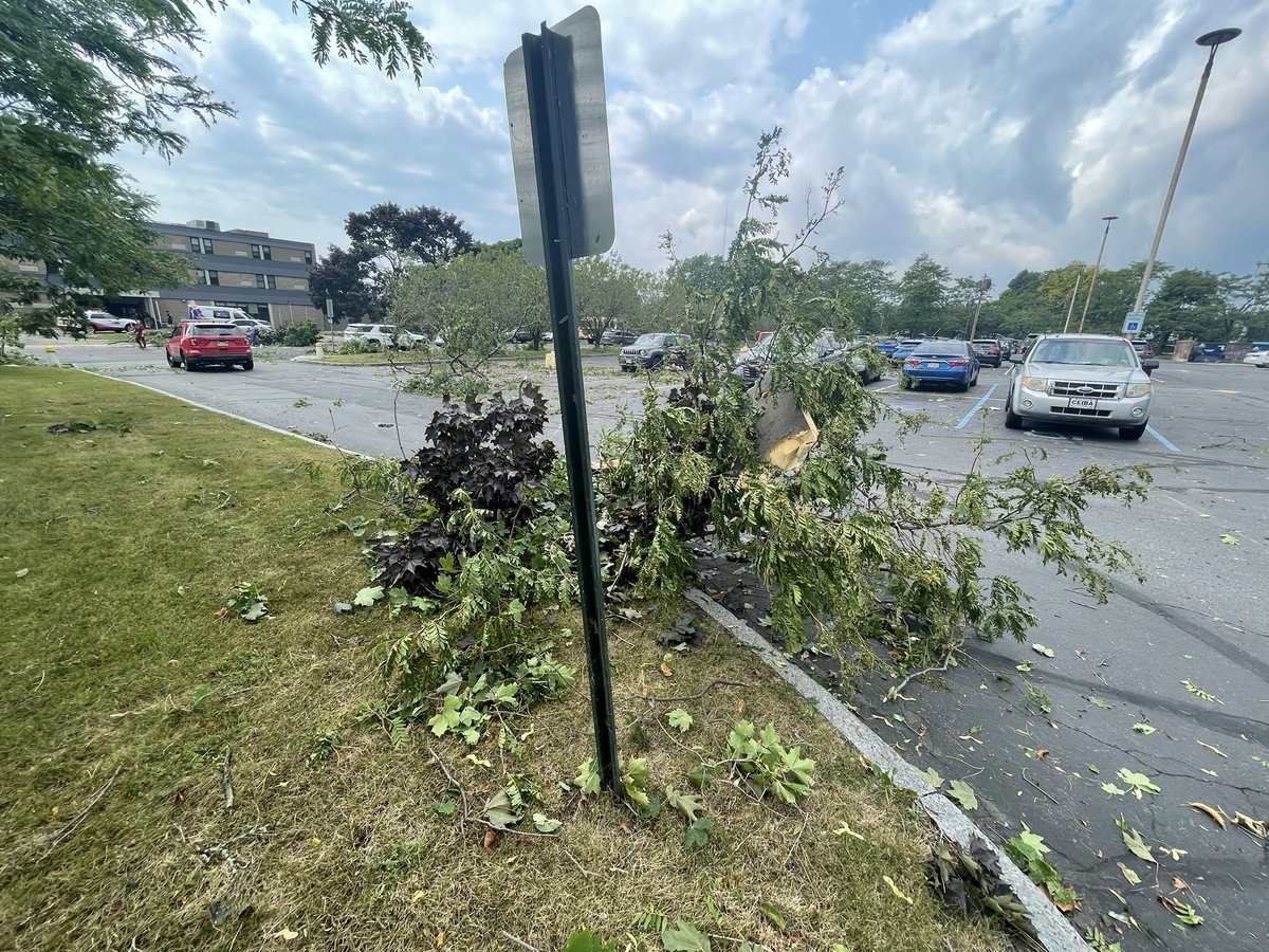 Amongst some of the wreckage you can see, what appears to be, some pieces of roofing and insulation from nearby buildings. The Neighborhood Health Center has a good amount of damage in the parking lot, and also a window pane broken at their entrance