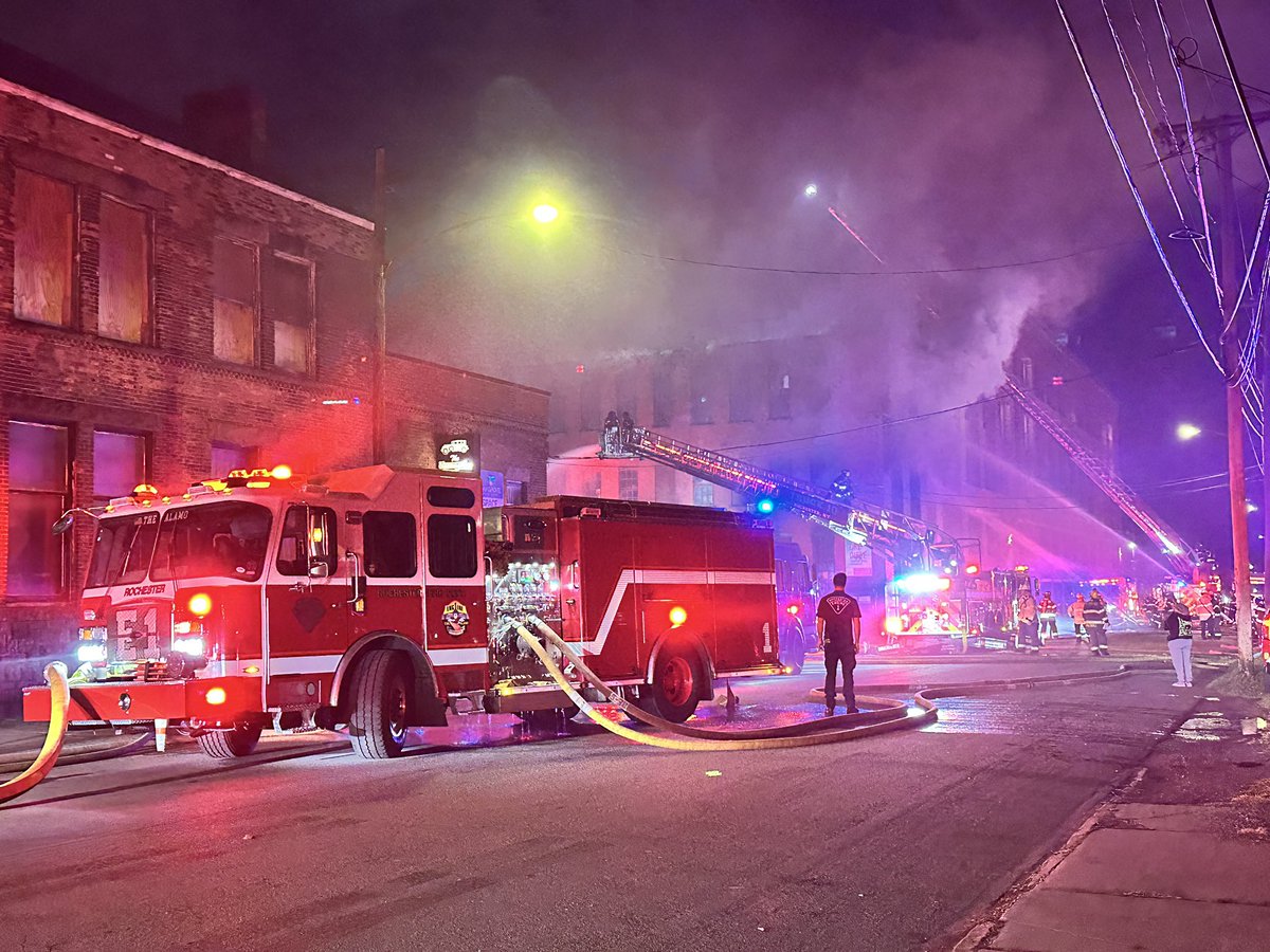 Collapse zone established. Most of the visible fire on the front of the building is knocked down. Heavy smoke still pushes from the 4th floor