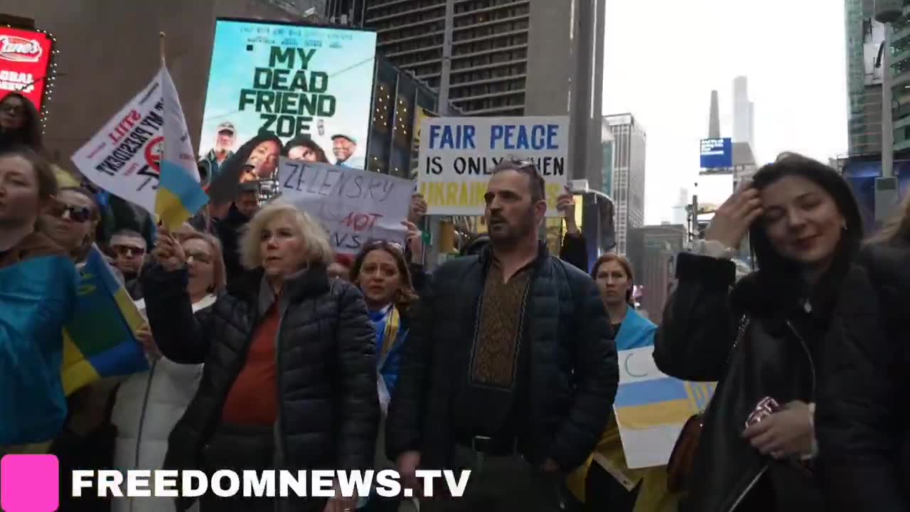 Ukrainians sing American national anthem as they gather in Times Square in Emergency protest