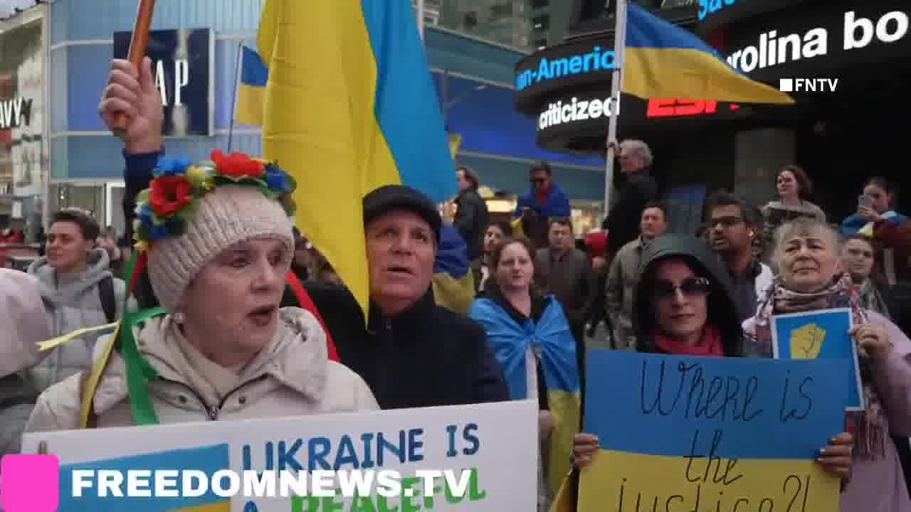 Ukrainians sing American national anthem as they gather in Times Square in Emergency protest