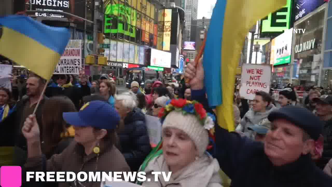 Ukrainians sing American national anthem as they gather in Times Square in Emergency protest
