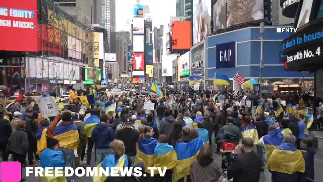 Ukrainians sing American national anthem as they gather in Times Square in Emergency protest
