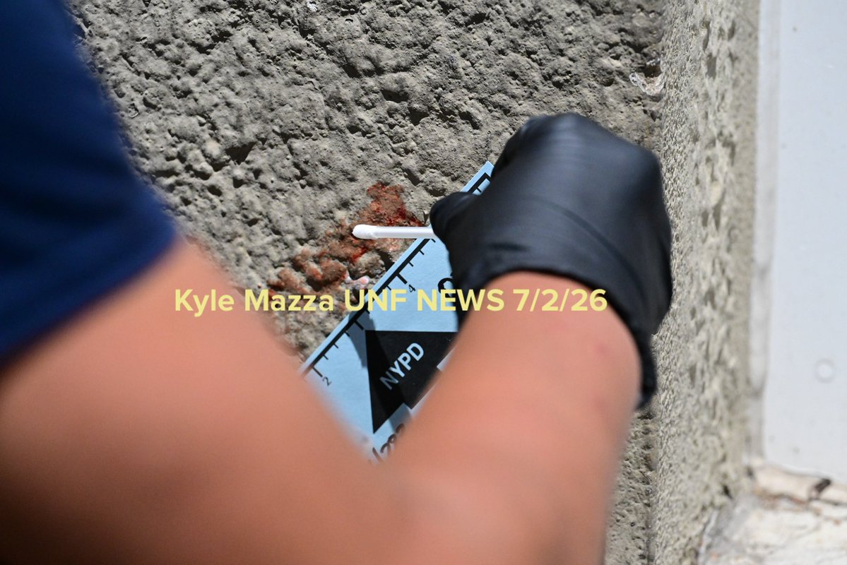 NYPD officers work the scene where 25-year-old Kycell Terry was found fatally stabbed multiple times to the abdomen within the confines of the 121 precinct inside of 85 Ann Street in Staten Island 