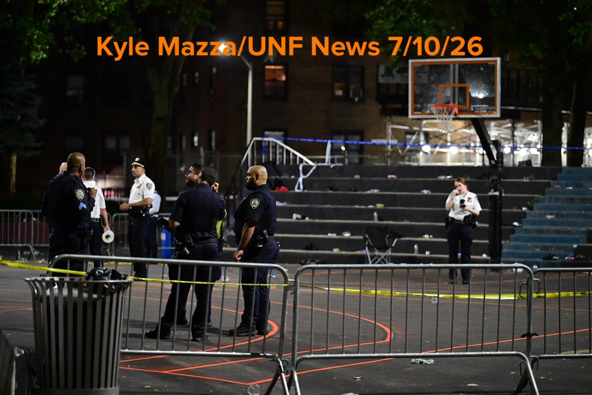 NYPD officers work the scene where one person was killed and two others were injured after a shooting inside of a basketball court at 70 Lenox Avenue within the confines of the 28 precinct PSA 5 in Manhattan, New York, United States