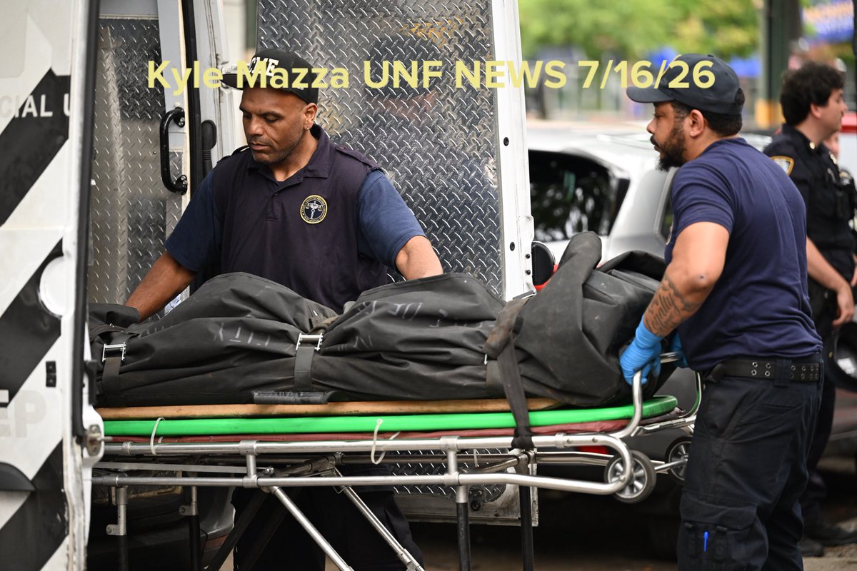 The body of a 29-year-old man who was fatally shot to the head is removed from the outside of a restaurant and lounge at 2362 Jerome Avenue within the confines of the 46 precinct in Bronx, New York, United States  