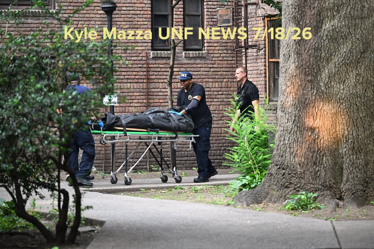 NYC Office of the Chief Medical Examiner personnel removed the body of a 24-year-old man who was found fatally shot to the eye inside of an apartment building in the area of Macombs Place and Frederick Douglass Boulevard within the confines of the 32 precinct in Manhattan