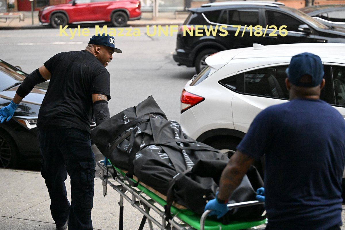 NYC Office of the Chief Medical Examiner personnel removed the body of a 24-year-old man who was found fatally shot to the eye inside of an apartment building in the area of Macombs Place and Frederick Douglass Boulevard within the confines of the 32 precinct in Manhattan 