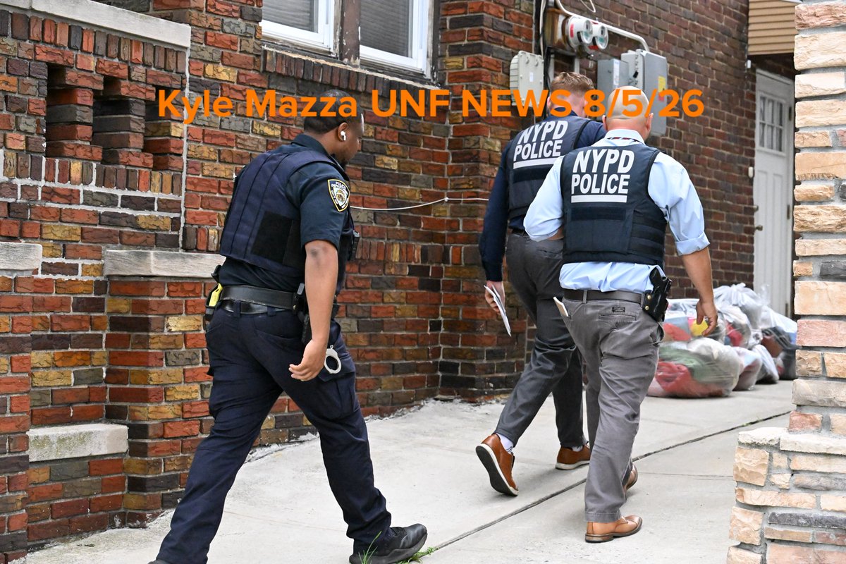 NYPD officers work the scene where a 6-month-old boy died inside of a home in the vicinity of Flatlands Avenue and East 99th Street in Brooklyn, New York