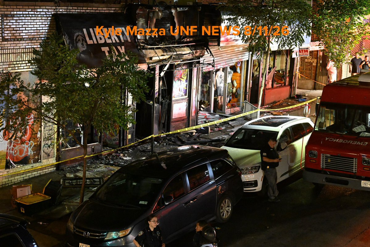 Members of the NYPD and FDNY work the scene of a fire that damaged several businesses in the area of West 183 Street within the confines of the 52 precinct in Bronx, New York, United States on August 11, 2026. Tuesday evening at approximately 10:11 pm the incident took place. A man in his 30s suffered severe burns to the face and body. Investigators are working to determine the cause of the fire.