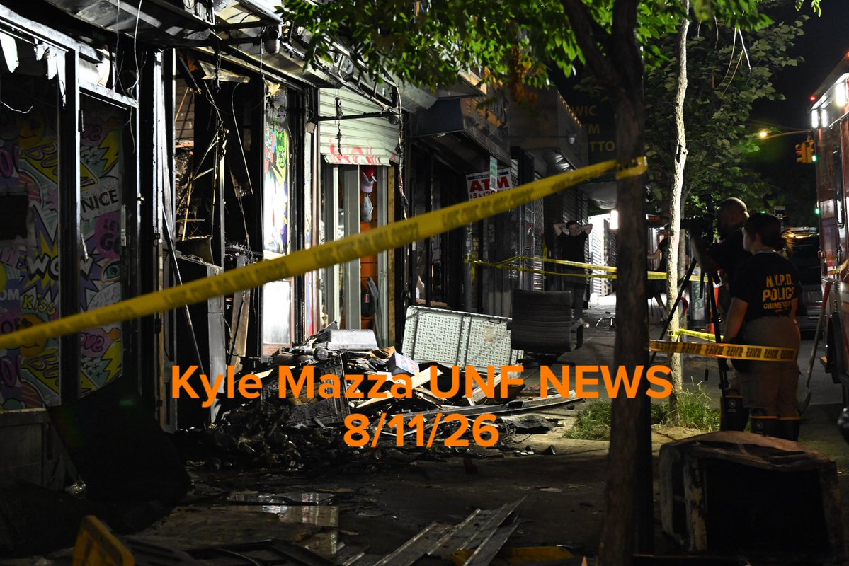 Members of the NYPD Crime Scene Unit work the scene of a fire that damaged several businesses in the area of West 183 Street within the confines of the 52 precinct in Bronx, New York 