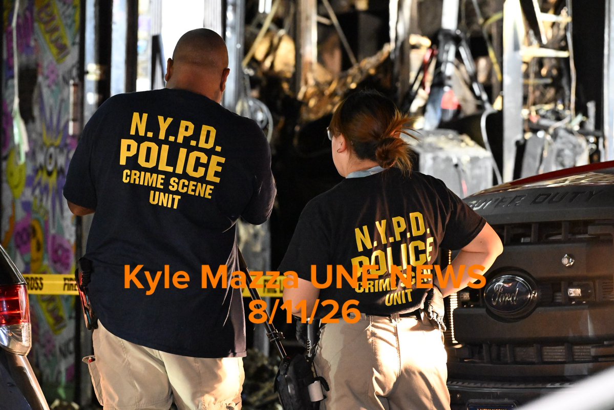 Members of the NYPD Crime Scene Unit work the scene of a fire that damaged several businesses in the area of West 183 Street within the confines of the 52 precinct in Bronx, New York 