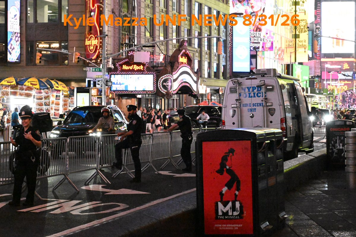 Crime scene unit investigators collect evidence including blood and shell casings at the scene after NYPD officers shot and killed a knife-wielding woman who fatally stabbed a woman and injured a man in Times Square near the area of West 42nd Street and 7th Avenue  