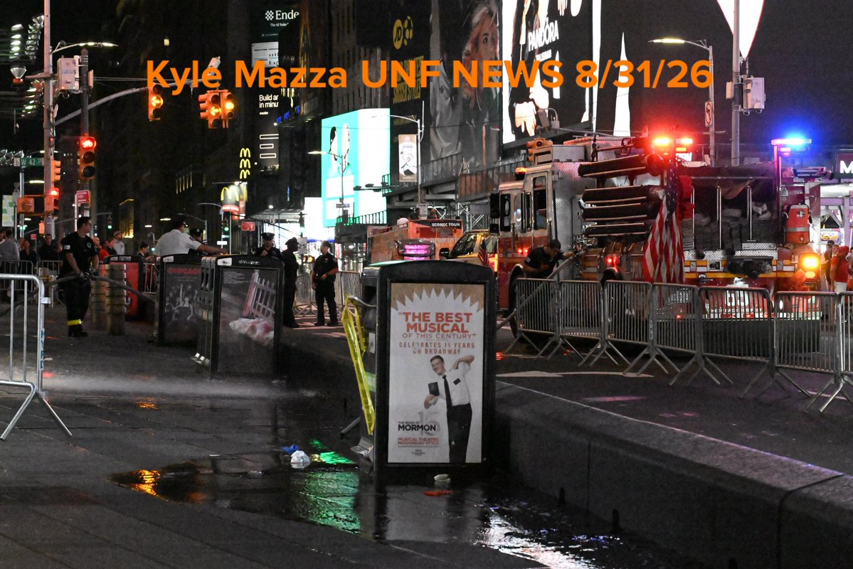 FDNY firefighters wash down the scene after NYPD officers shot and killed a knife-wielding woman who fatally stabbed a woman and injured a man in Times Square near the area of West 42nd Street and 7th Avenue in Times Square, Manhattan 