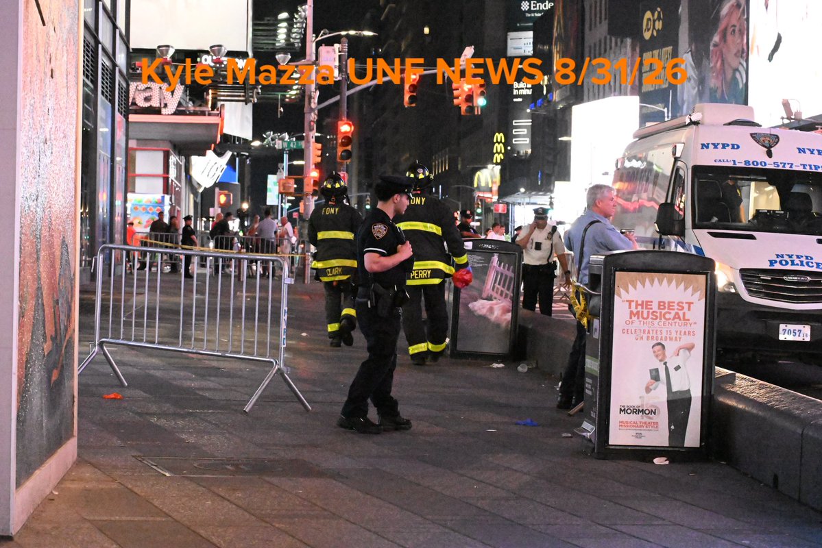 FDNY firefighters wash down the scene after NYPD officers shot and killed a knife-wielding woman who fatally stabbed a woman and injured a man in Times Square near the area of West 42nd Street and 7th Avenue in Times Square, Manhattan 