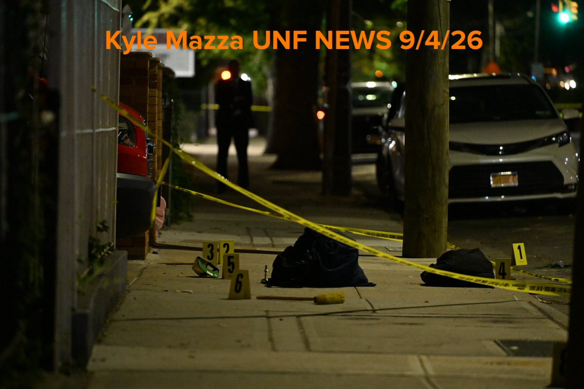 NYPD crime scene unit investigators mark evidence including a hat, broom, broom stick pieces and other items at the scene where 25-year-old Christopher Davey was fatally stabbed multiple times at 882 Albany Avenue within the confines of the 67 precinct in Brooklyn, New York, United States