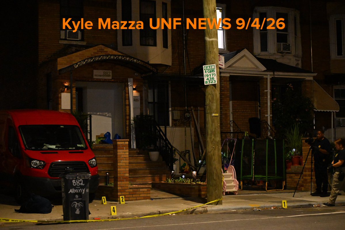 NYPD crime scene unit investigators mark evidence including a hat, broom, broom stick pieces and other items at the scene where 25-year-old Christopher Davey was fatally stabbed multiple times at 882 Albany Avenue within the confines of the 67 precinct in Brooklyn, New York, United States