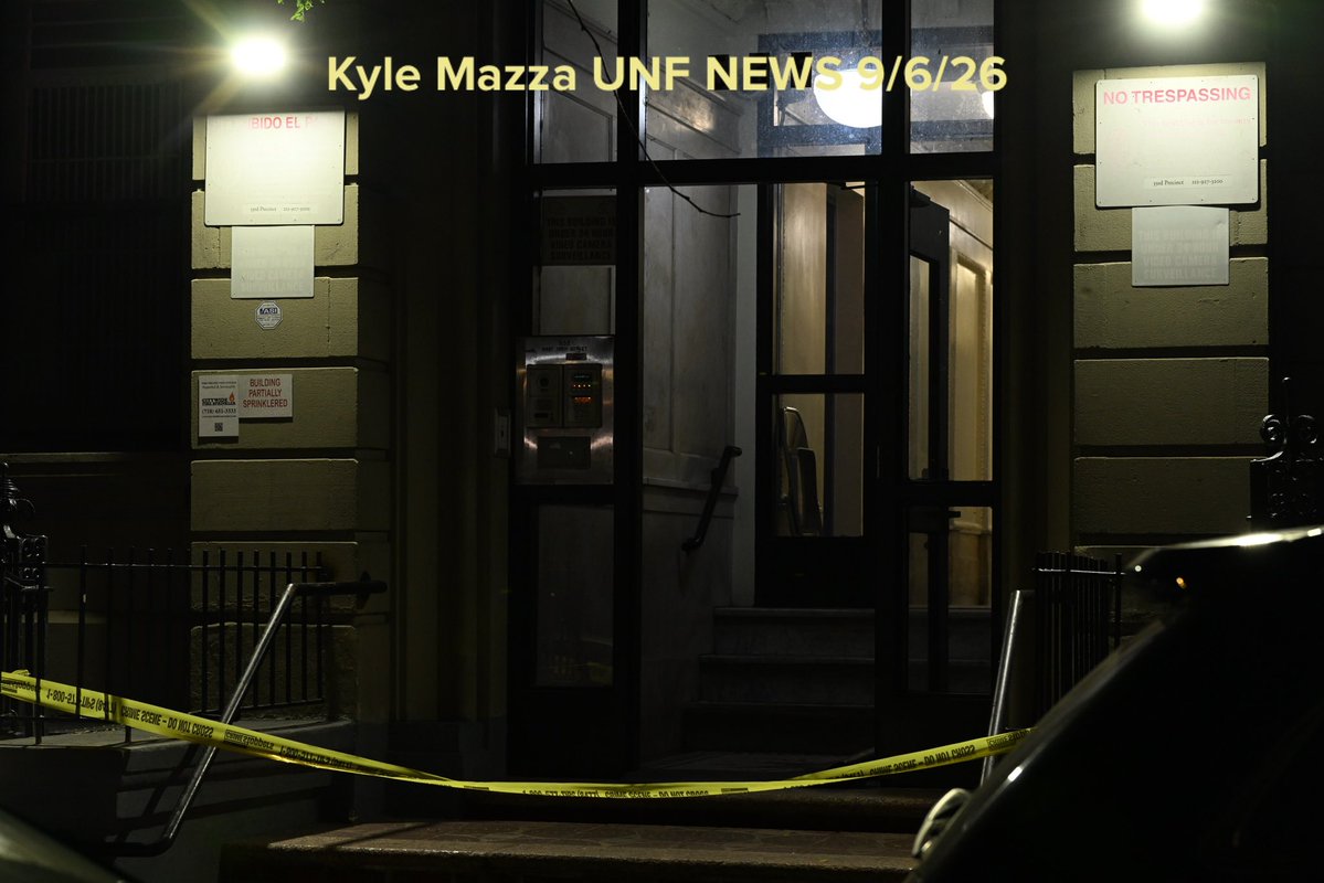 NYPD officers work the scene where a 27-year-old woman was murdered inside of 535 West 156 Street within the confines of the 33 precinct in Manhattan, New York, United States 