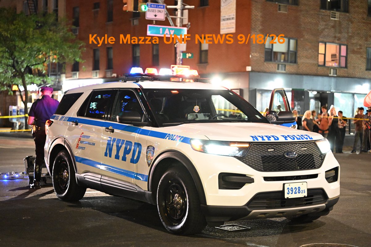 NYPD officers work the scene where two people were struck by a truck in the area of East 14th Street and 1st Avenue in Manhattan, New York, United States on Friday